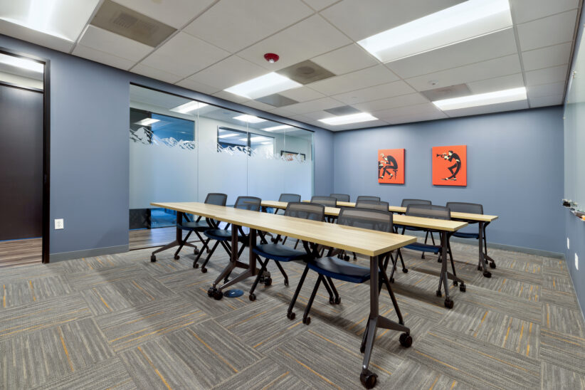 Large comfortable training room with huge white boards, privacy frost, rearrangeable furniture, large TV for display