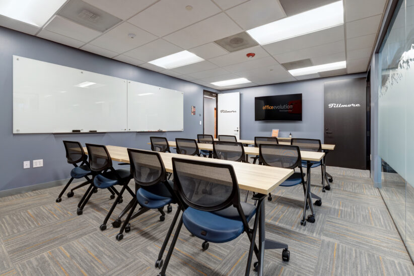 Large comfortable training room with huge white boards, privacy frost, rearrangeable furniture, large TV for display